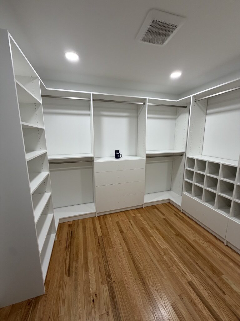 Custom walk-in closet by TrueForm Closets