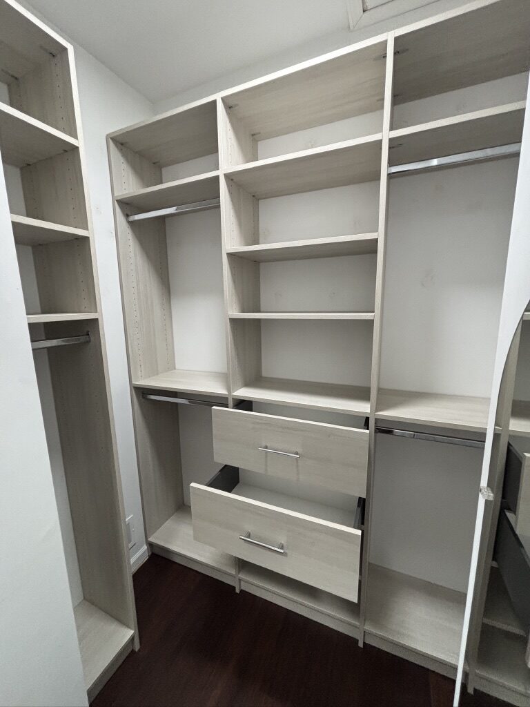 Custom walk-in closet by TrueForm Closets