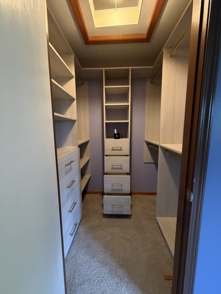 Custom walk-in closet by TrueForm Closets