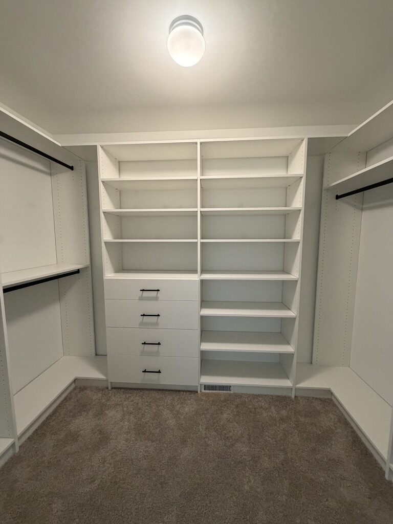 Custom walk-in closet by TrueForm Closets