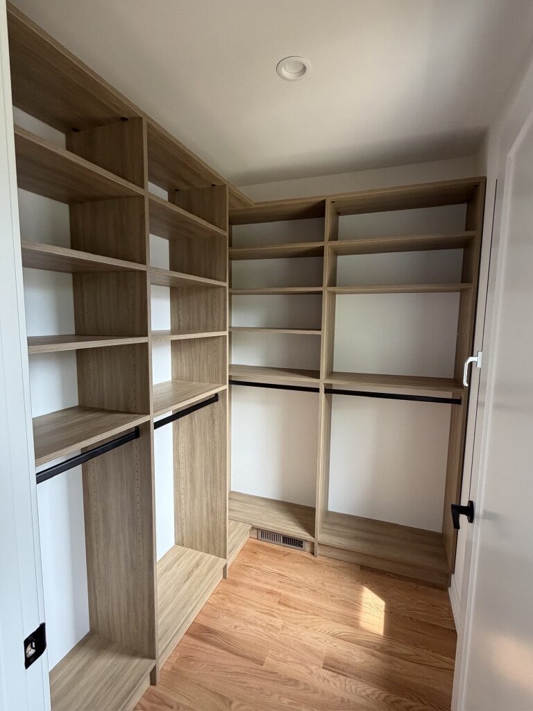 Custom walk-in closet by TrueForm Closets