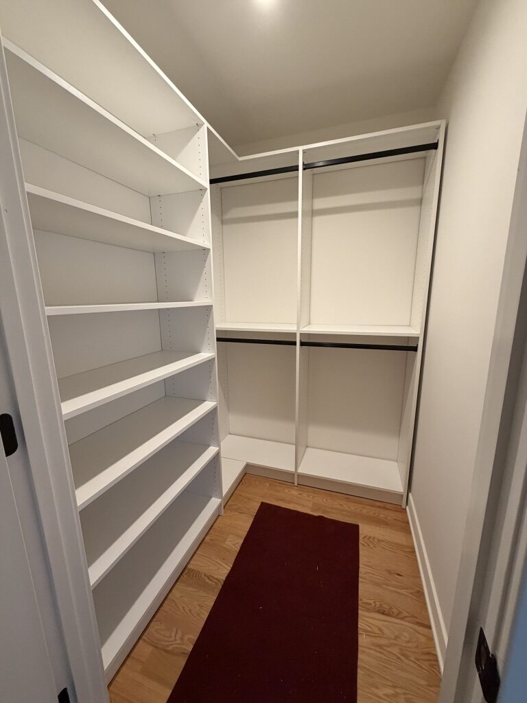 Custom walk-in closet by TrueForm Closets