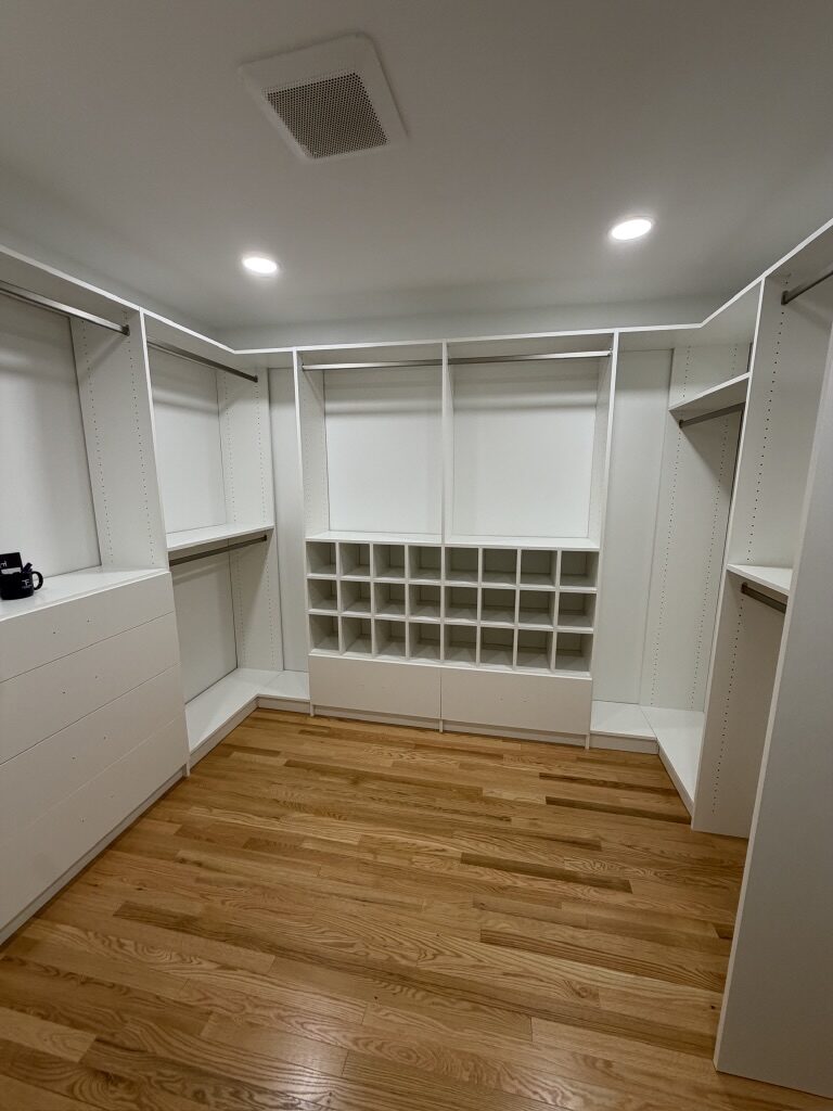 Custom walk-in closet by TrueForm Closets