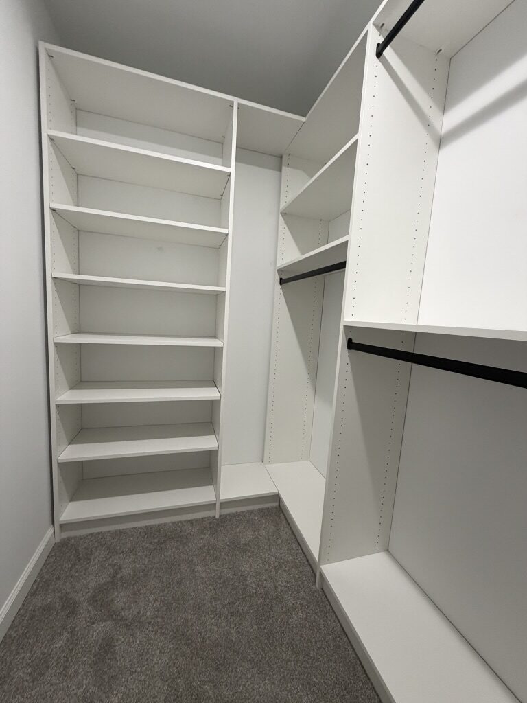 Custom walk-in closet by TrueForm Closets