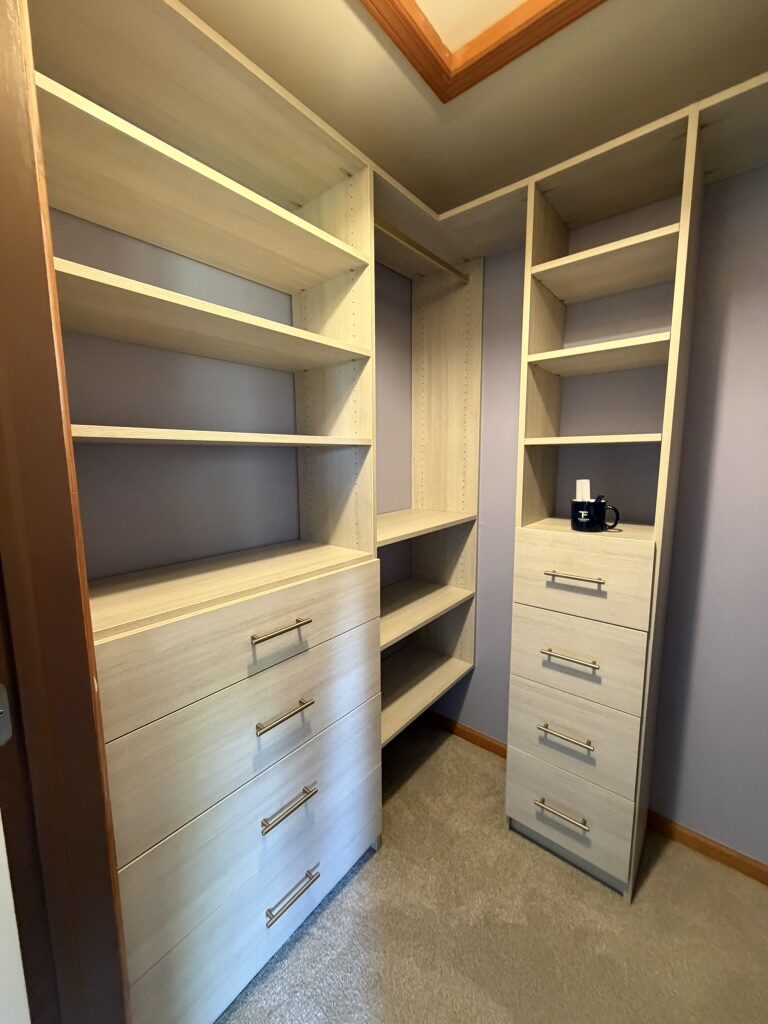 Custom walk-in closet by TrueForm Closets