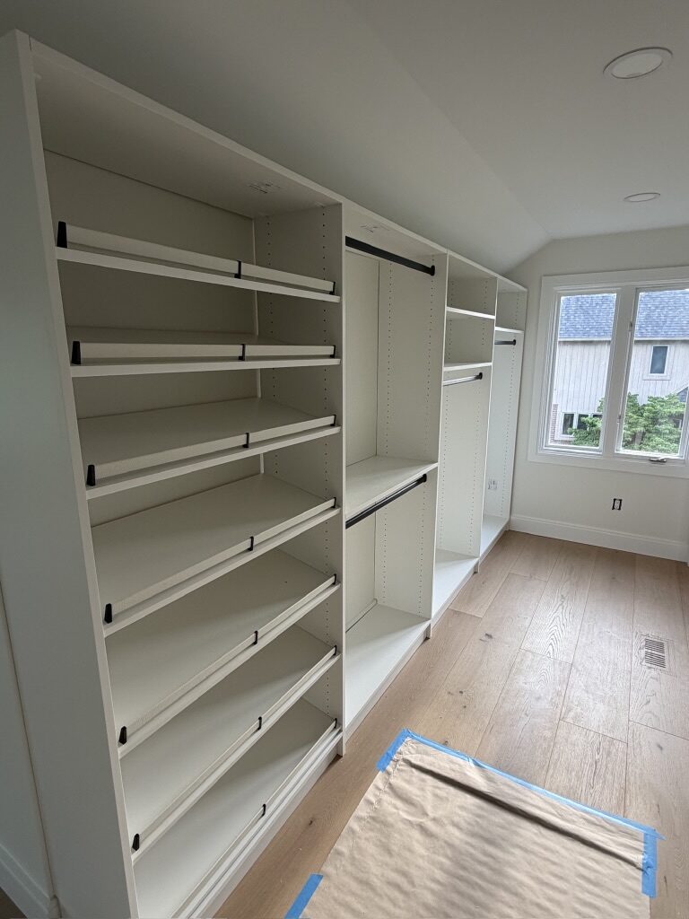 Custom walk-in closet by TrueForm Closets