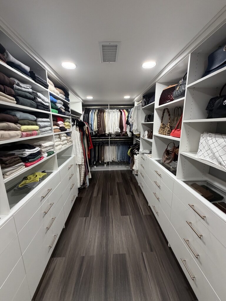 Custom walk-in closet by TrueForm Closets