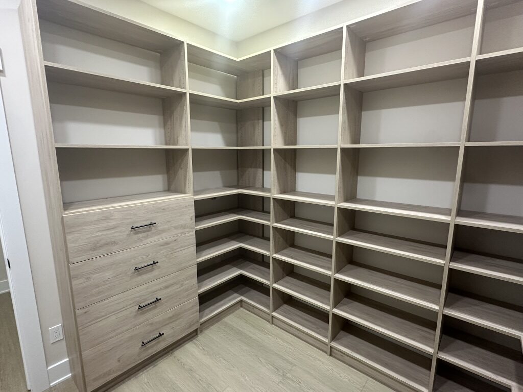 Custom walk-in closet by TrueForm Closets