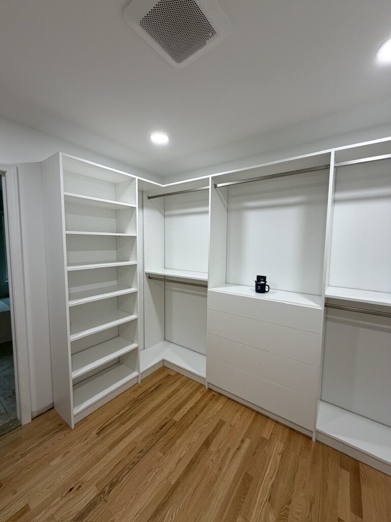 Custom walk-in closet by TrueForm Closets