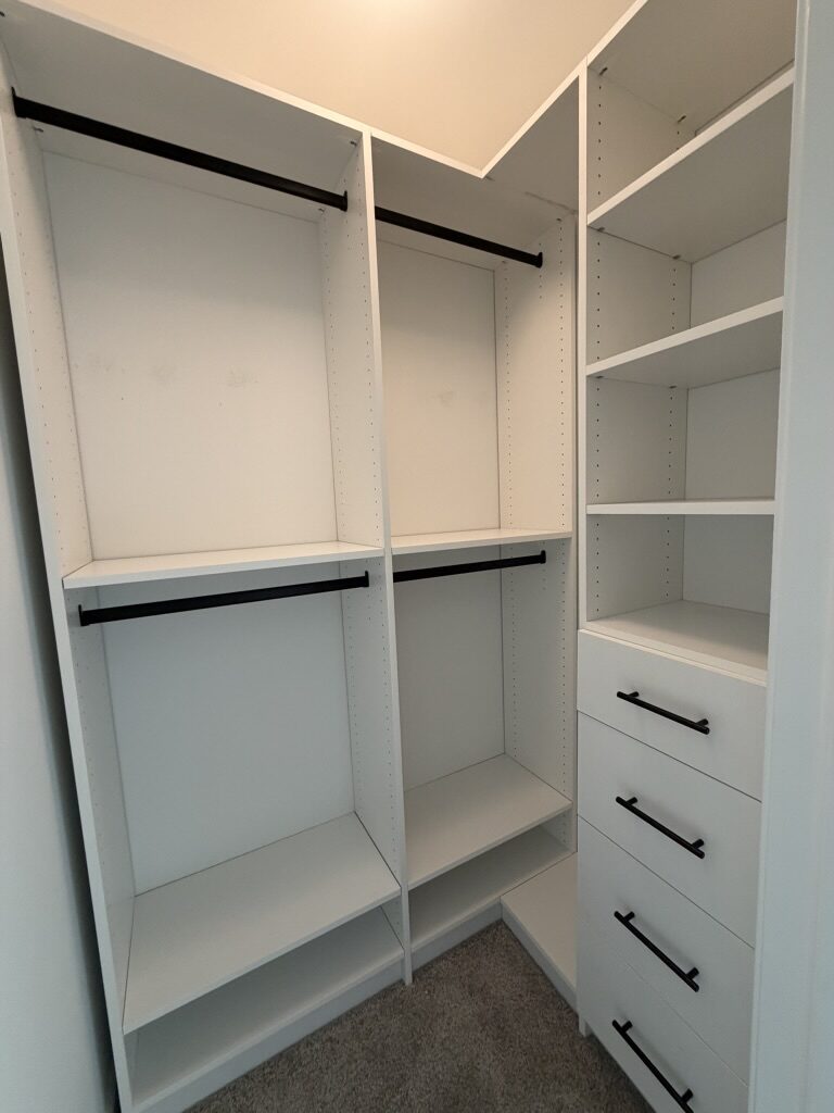 Custom walk-in closet by TrueForm Closets