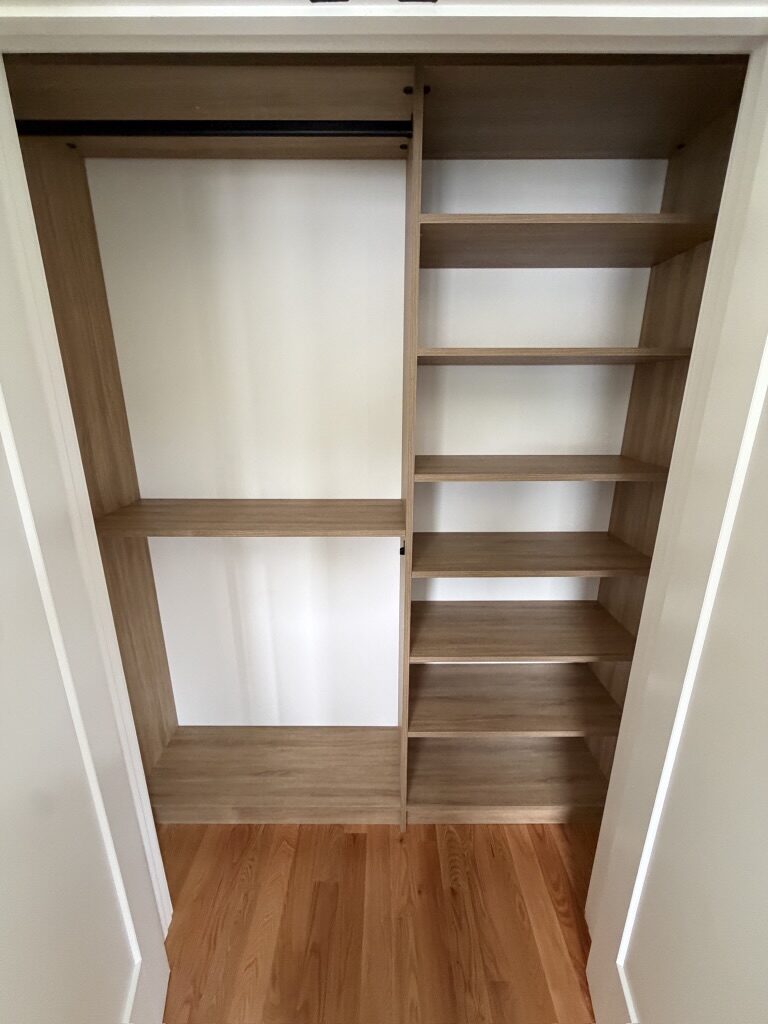 Custom reach-in closet by TrueForm Closets