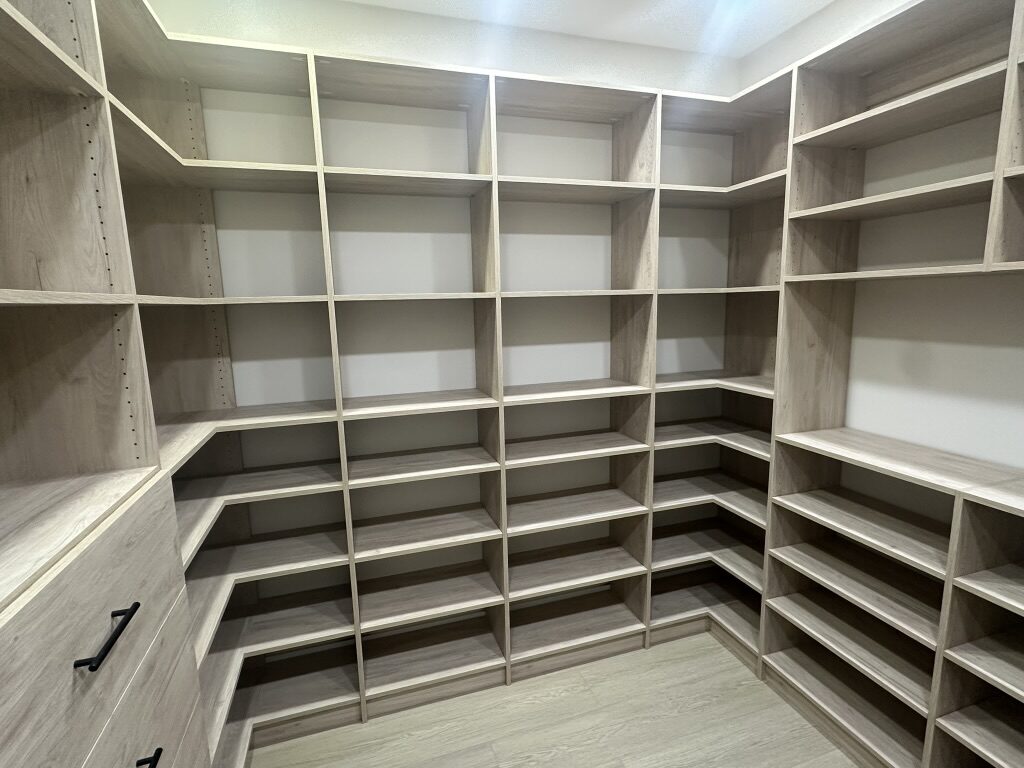 Custom walk-in closet by TrueForm Closets