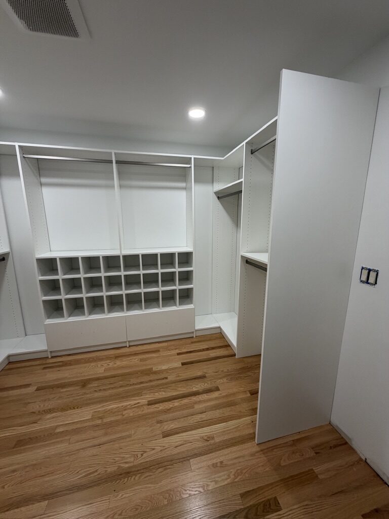 Custom walk-in closet by TrueForm Closets