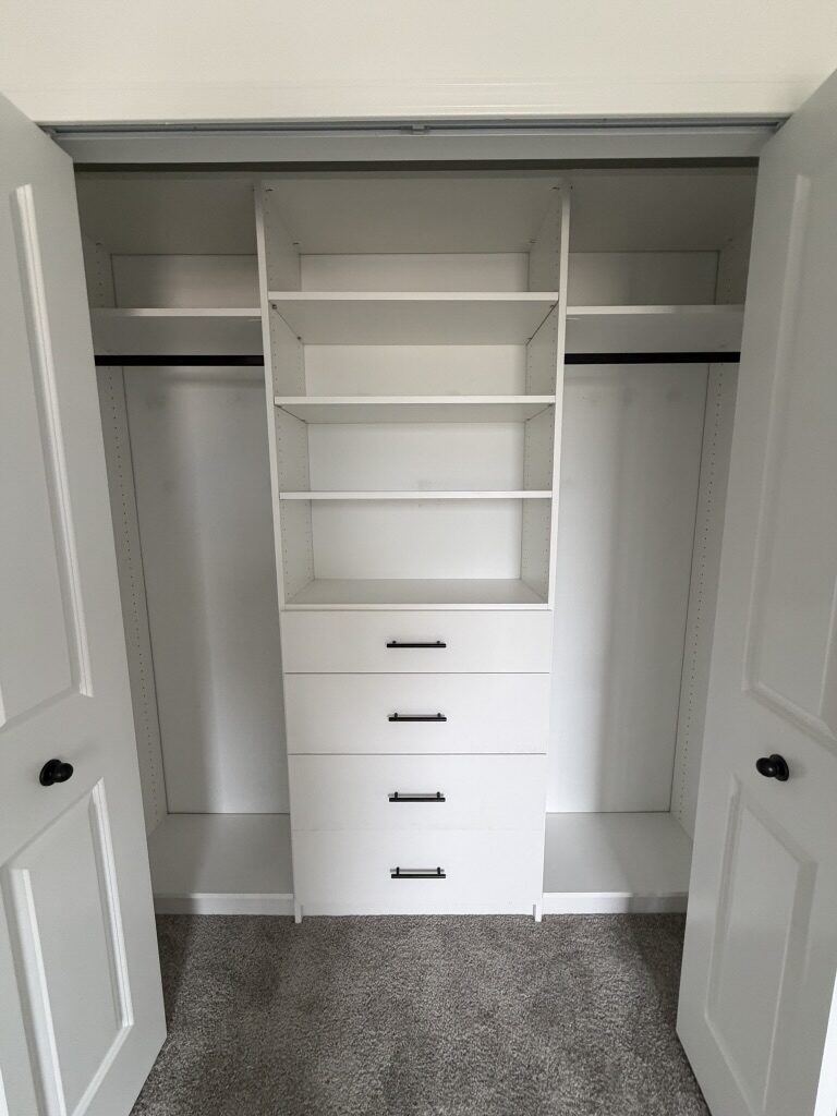 Custom reach-in closet by TrueForm Closets