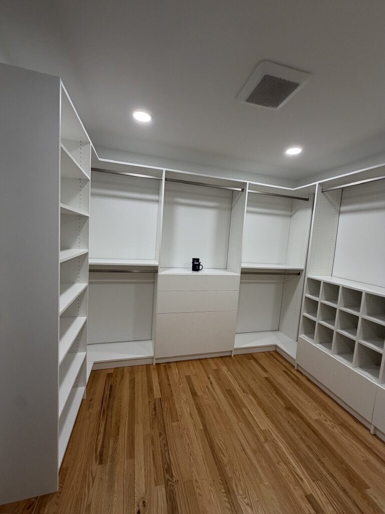 Custom walk-in closet by TrueForm Closets