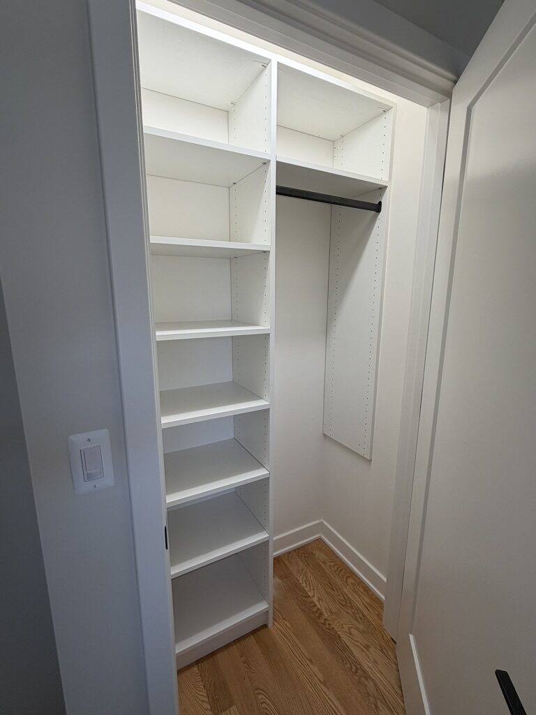 Custom reach-in closet by TrueForm Closets