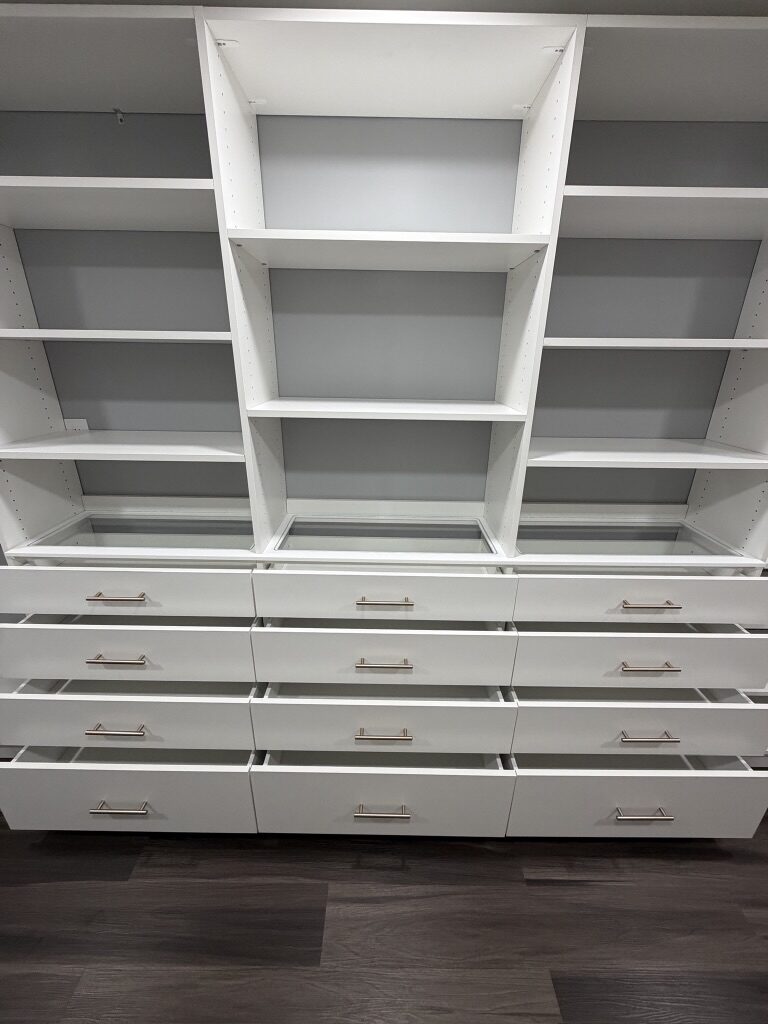 Custom walk-in closet by TrueForm Closets
