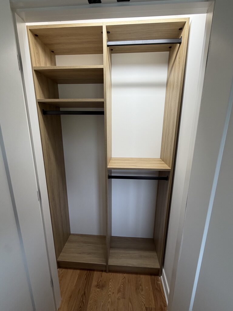 Custom reach-in closet by TrueForm Closets