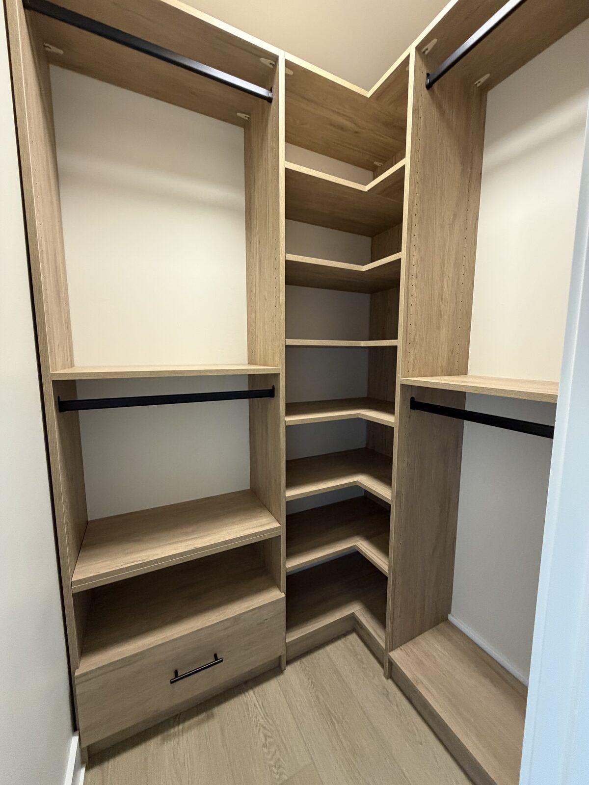 Custom walk-in closet by TrueForm Closets