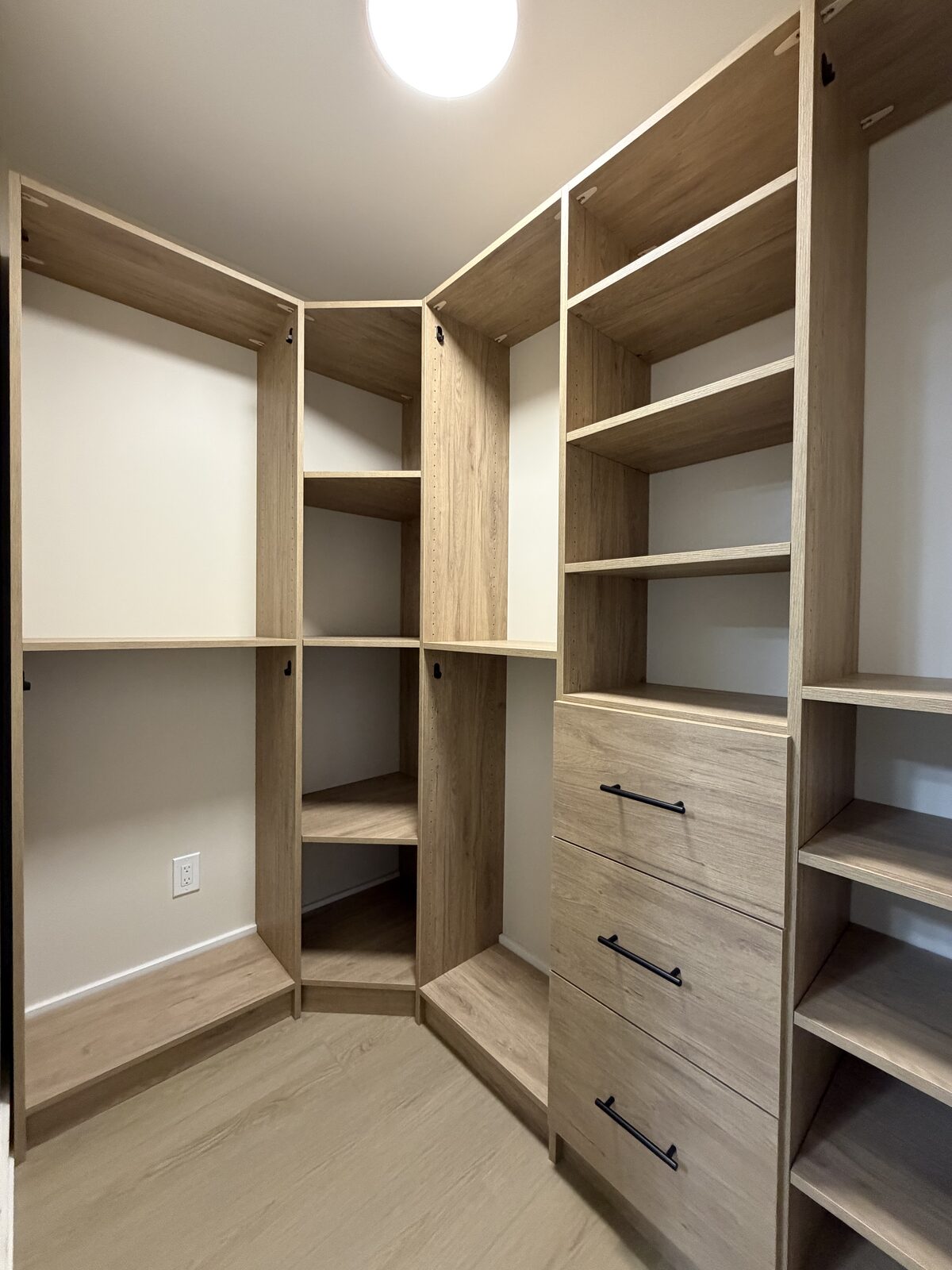 Custom walk-in closet by TrueForm Closets