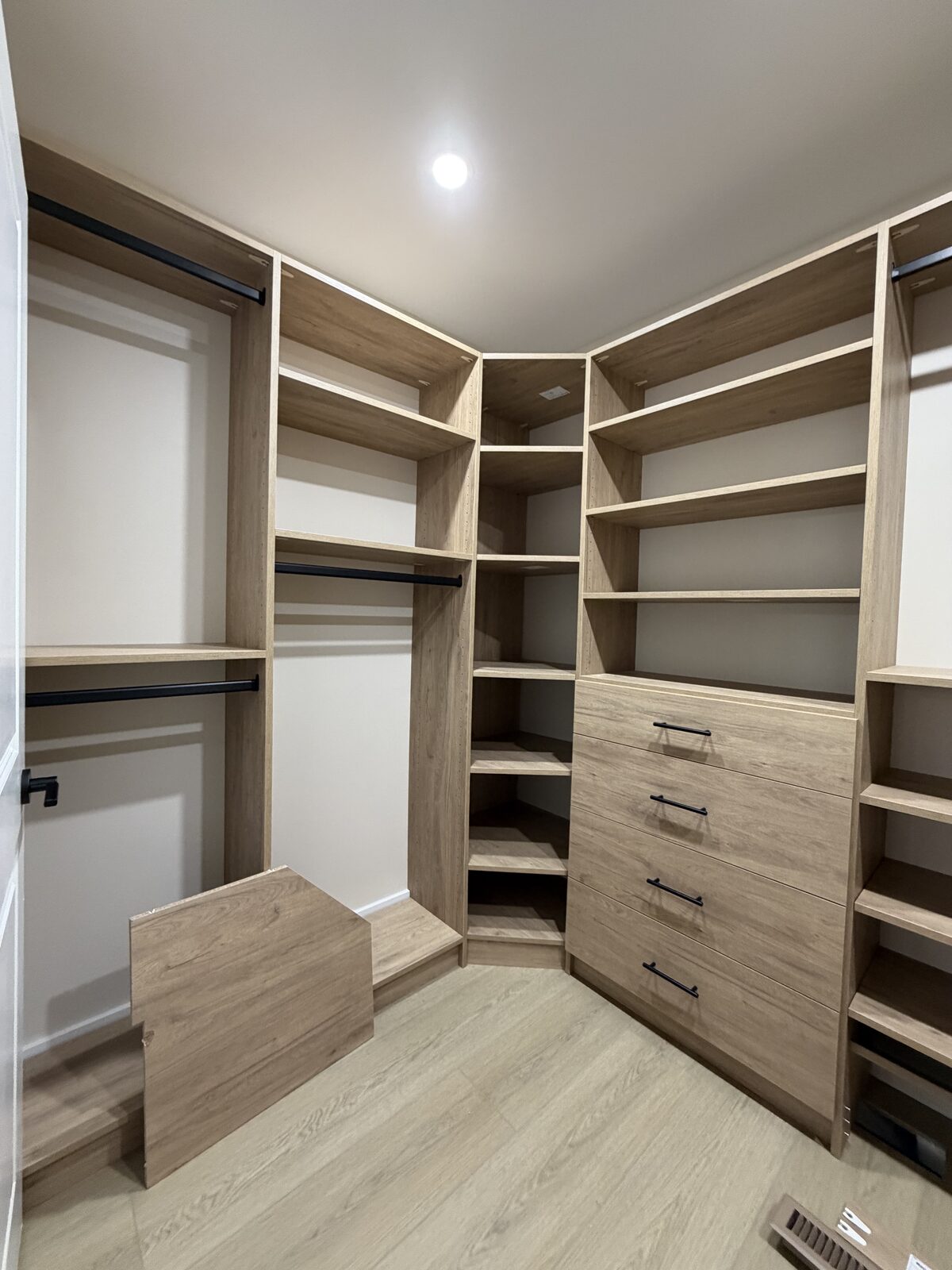 Custom walk-in closet by TrueForm Closets
