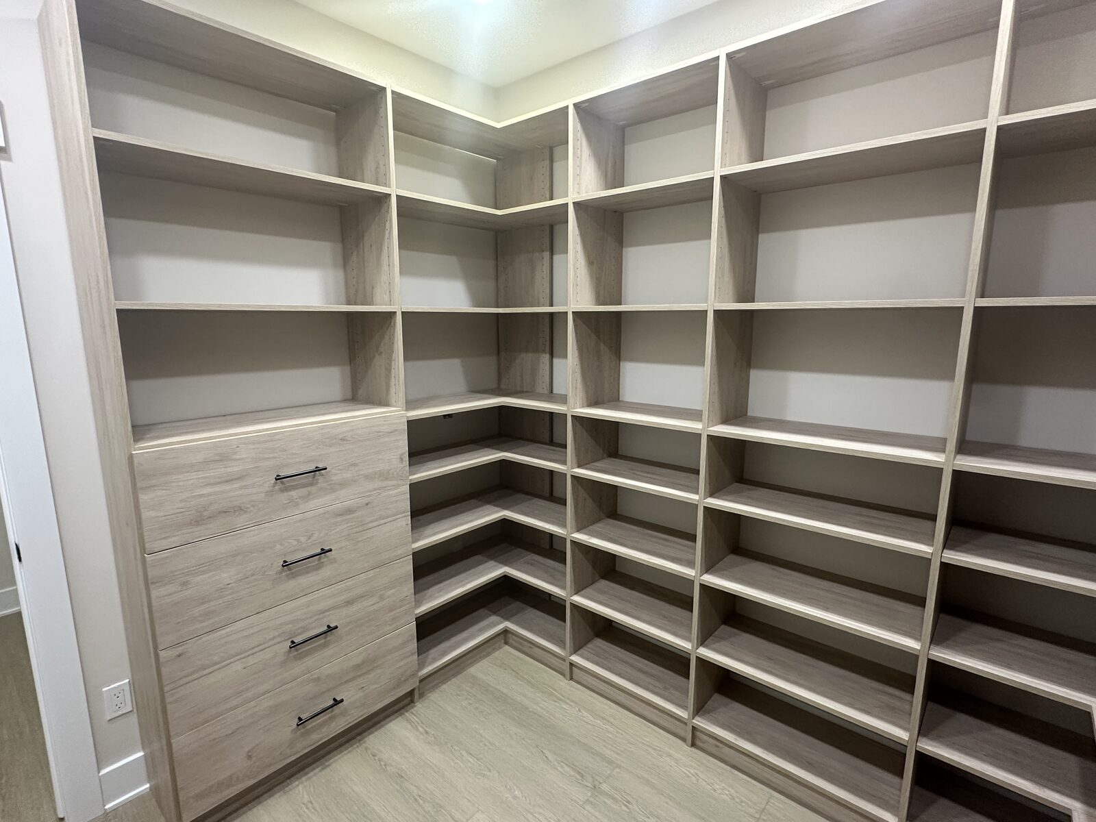 Custom walk-in closet by TrueForm Closets