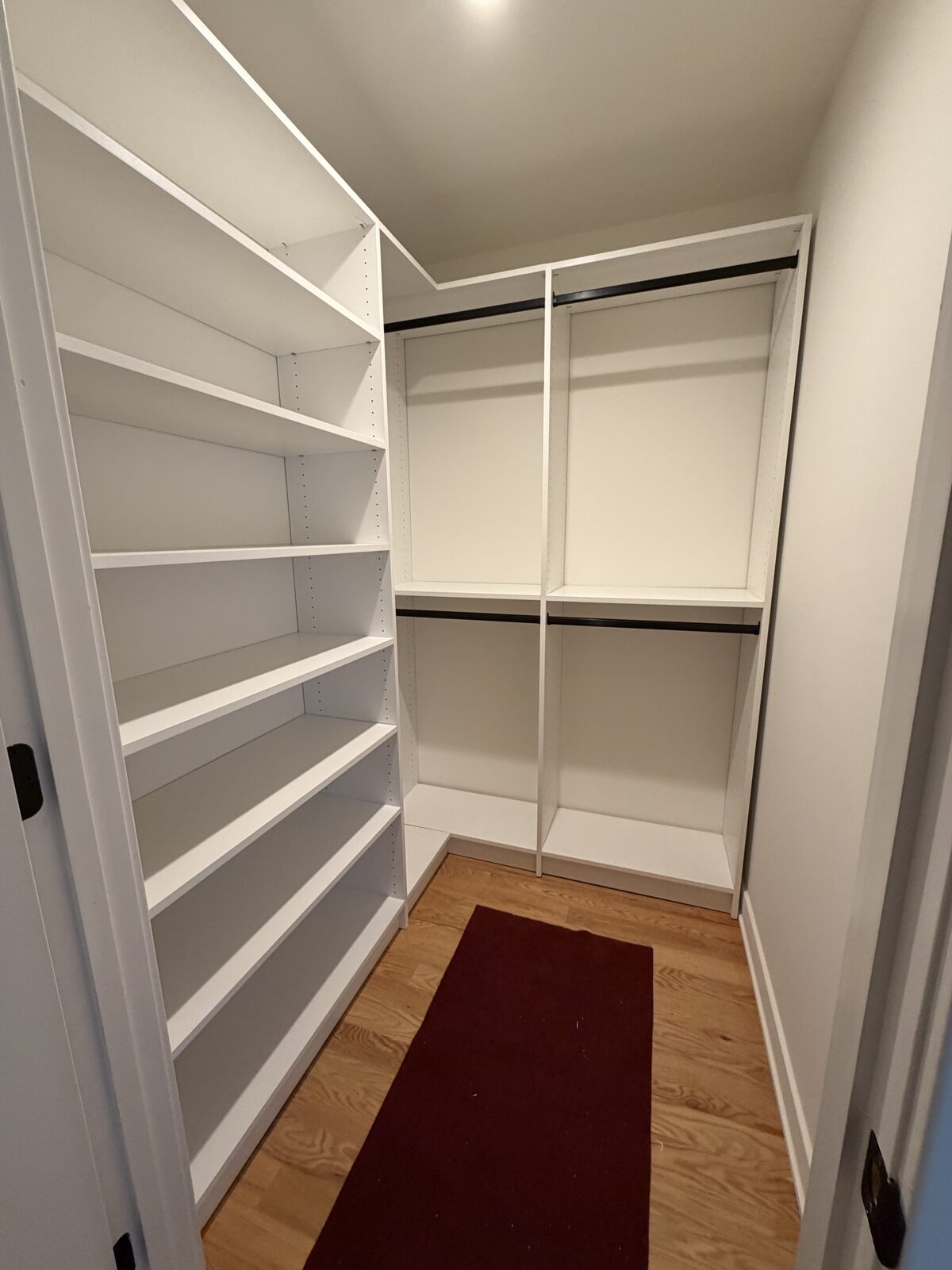 Custom walk-in closet by TrueForm Closets