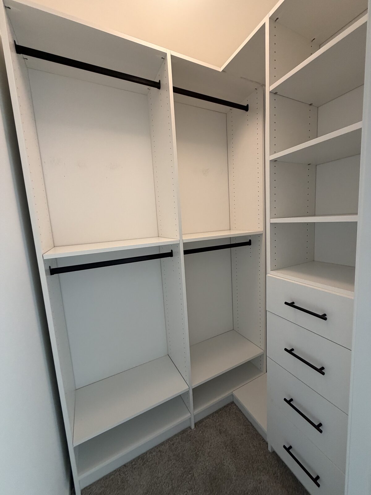 Custom walk-in closet by TrueForm Closets