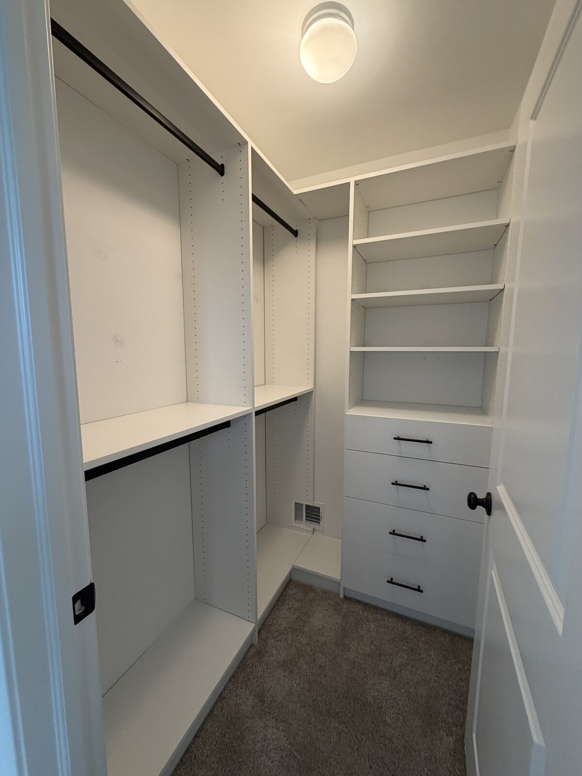 Custom walk-in closet by TrueForm Closets