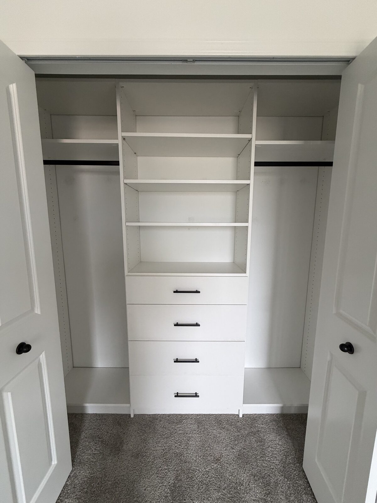 Custom reach-in closet by TrueForm Closets