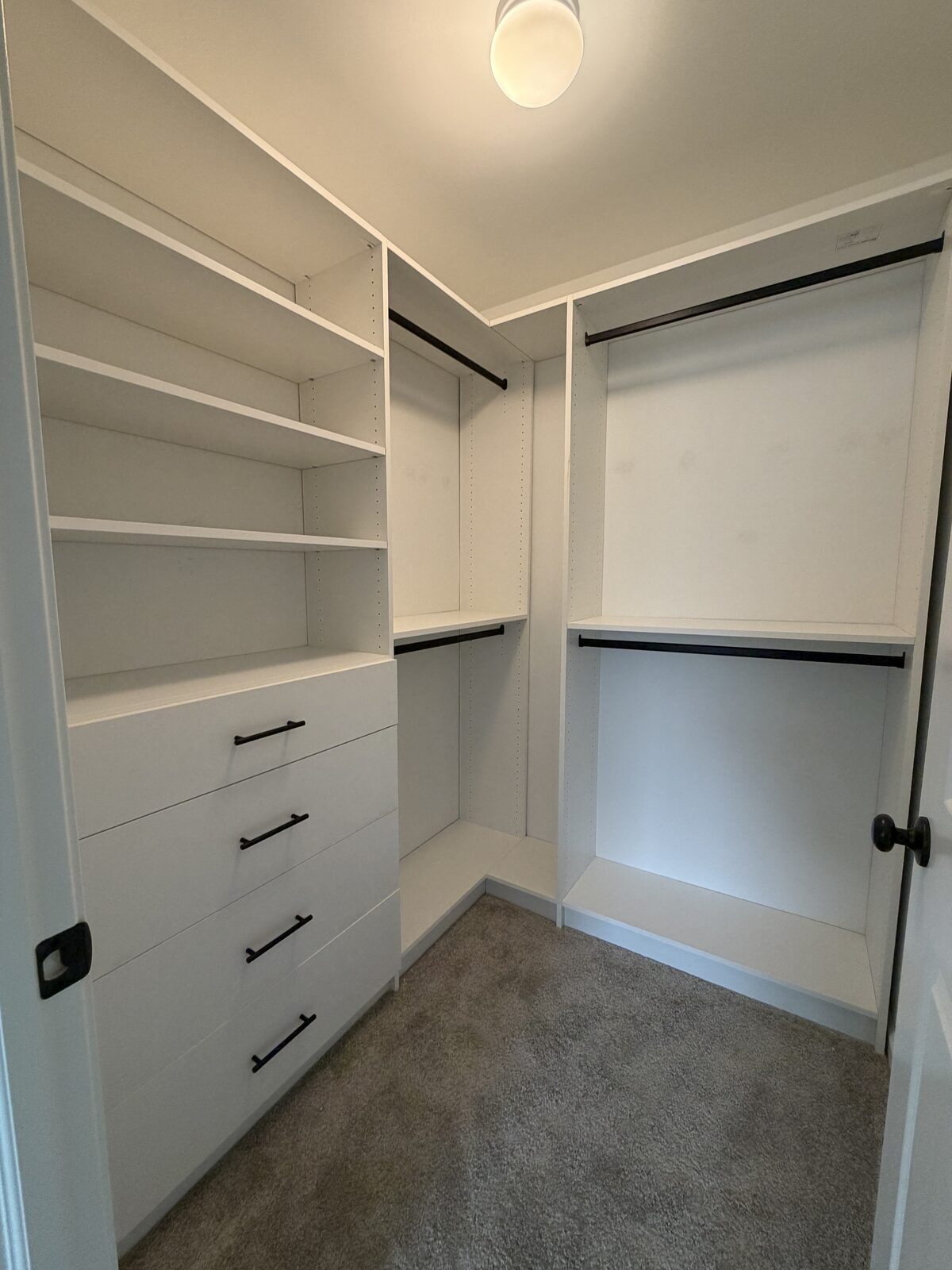 Custom walk-in closet by TrueForm Closets