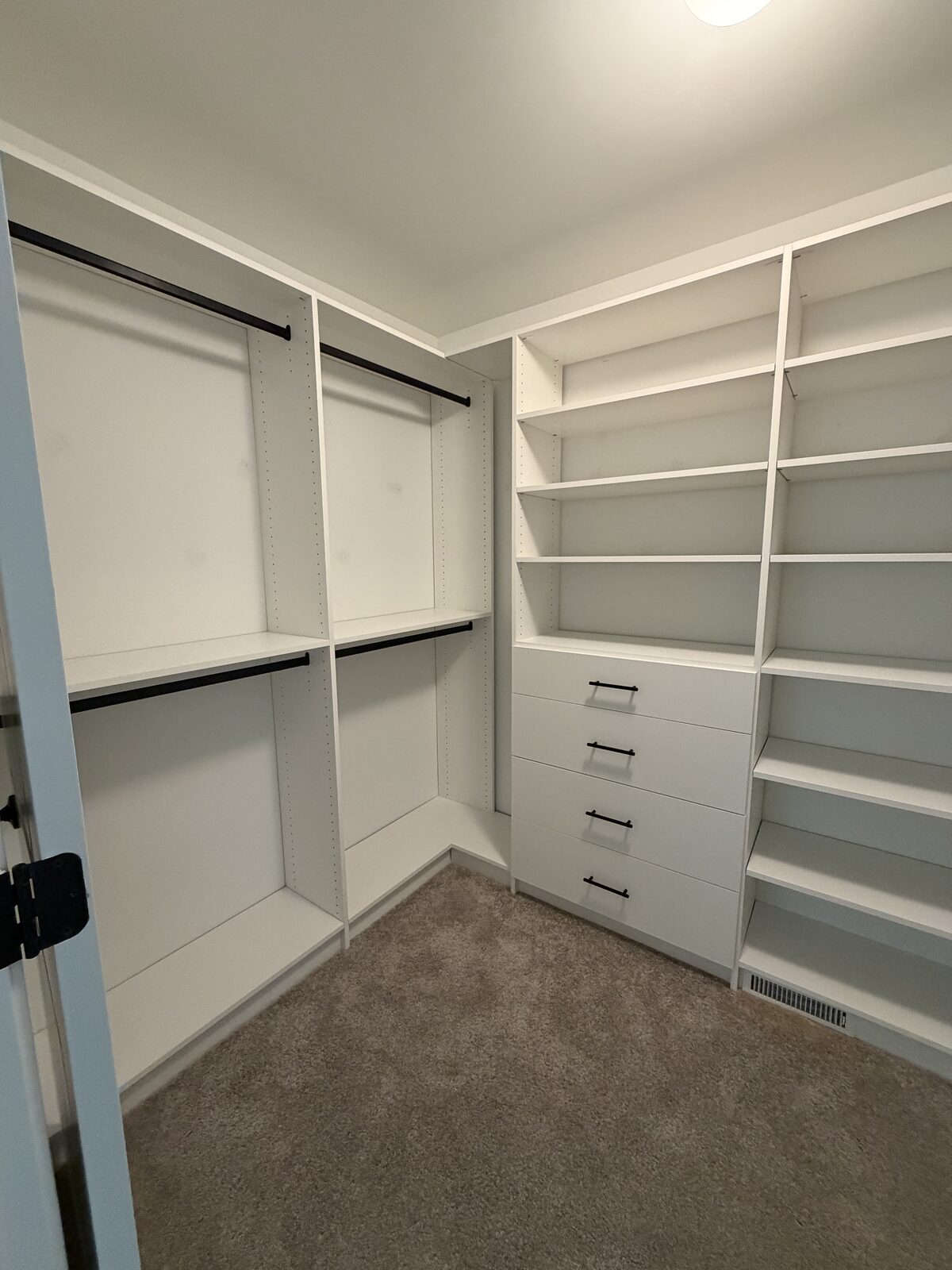 Custom walk-in closet by TrueForm Closets