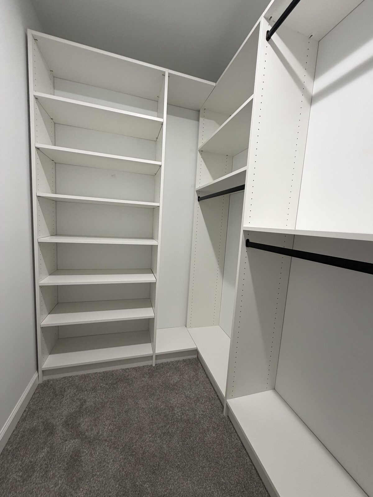 Custom walk-in closet by TrueForm Closets