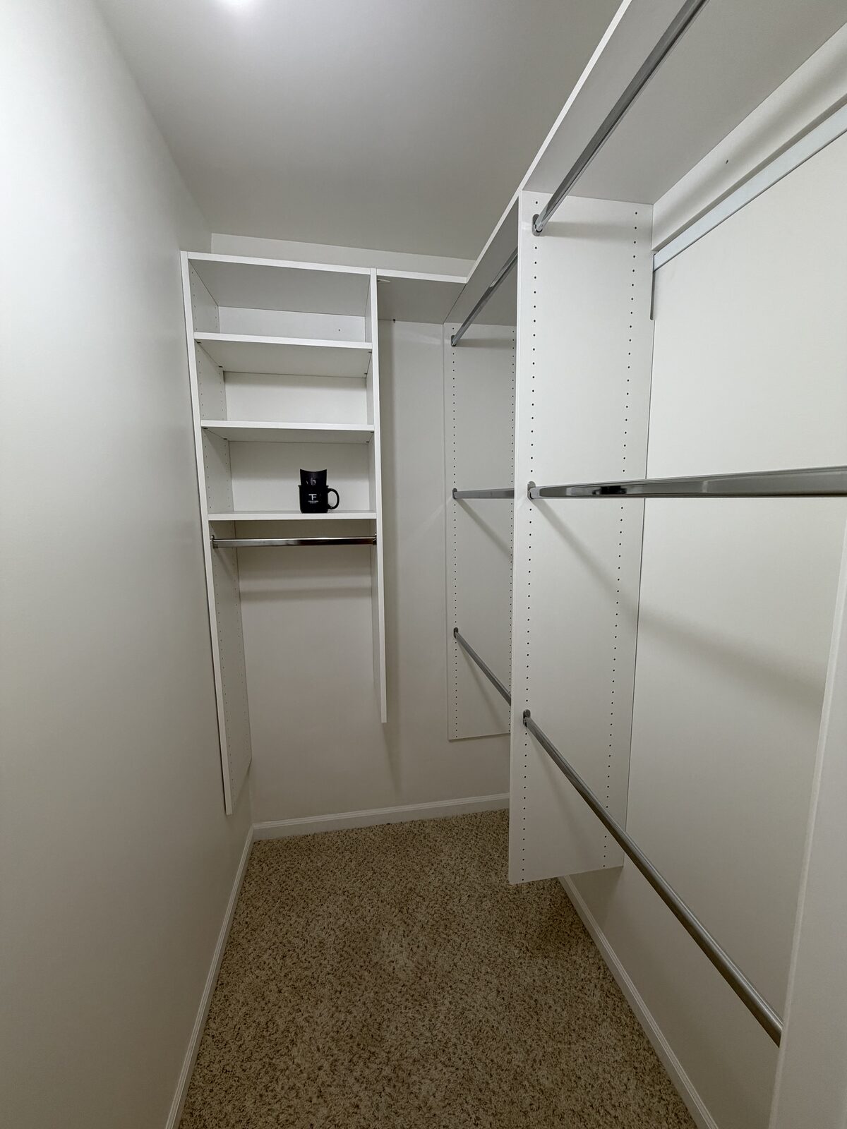 Custom walk-in closet by TrueForm Closets