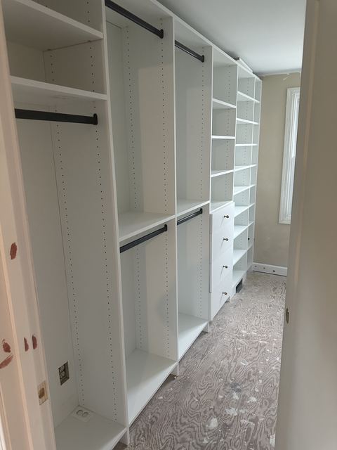 Northville his and hers closets by TrueForm Closets