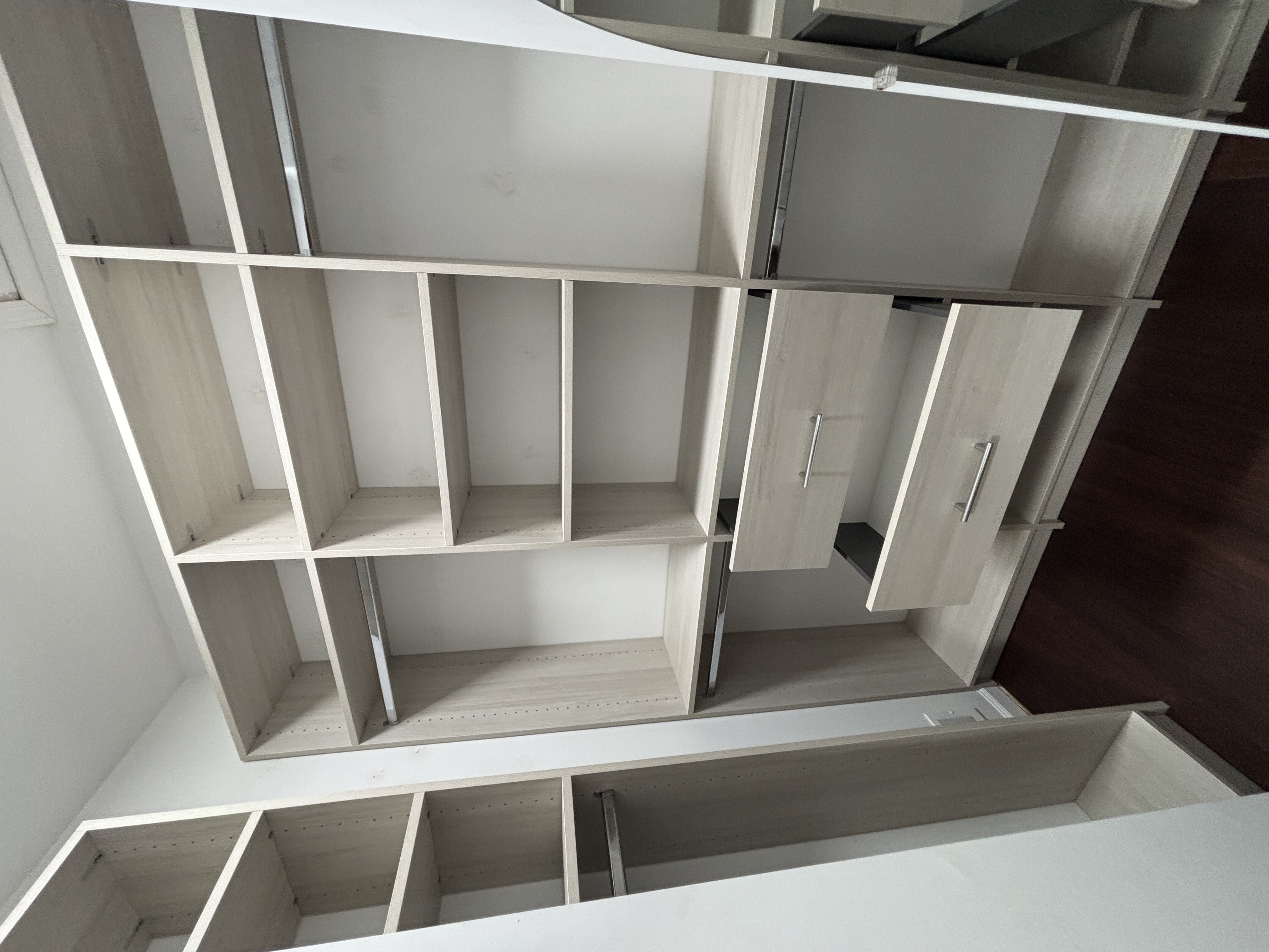 Walk-in closet with shelving and drawer storage
