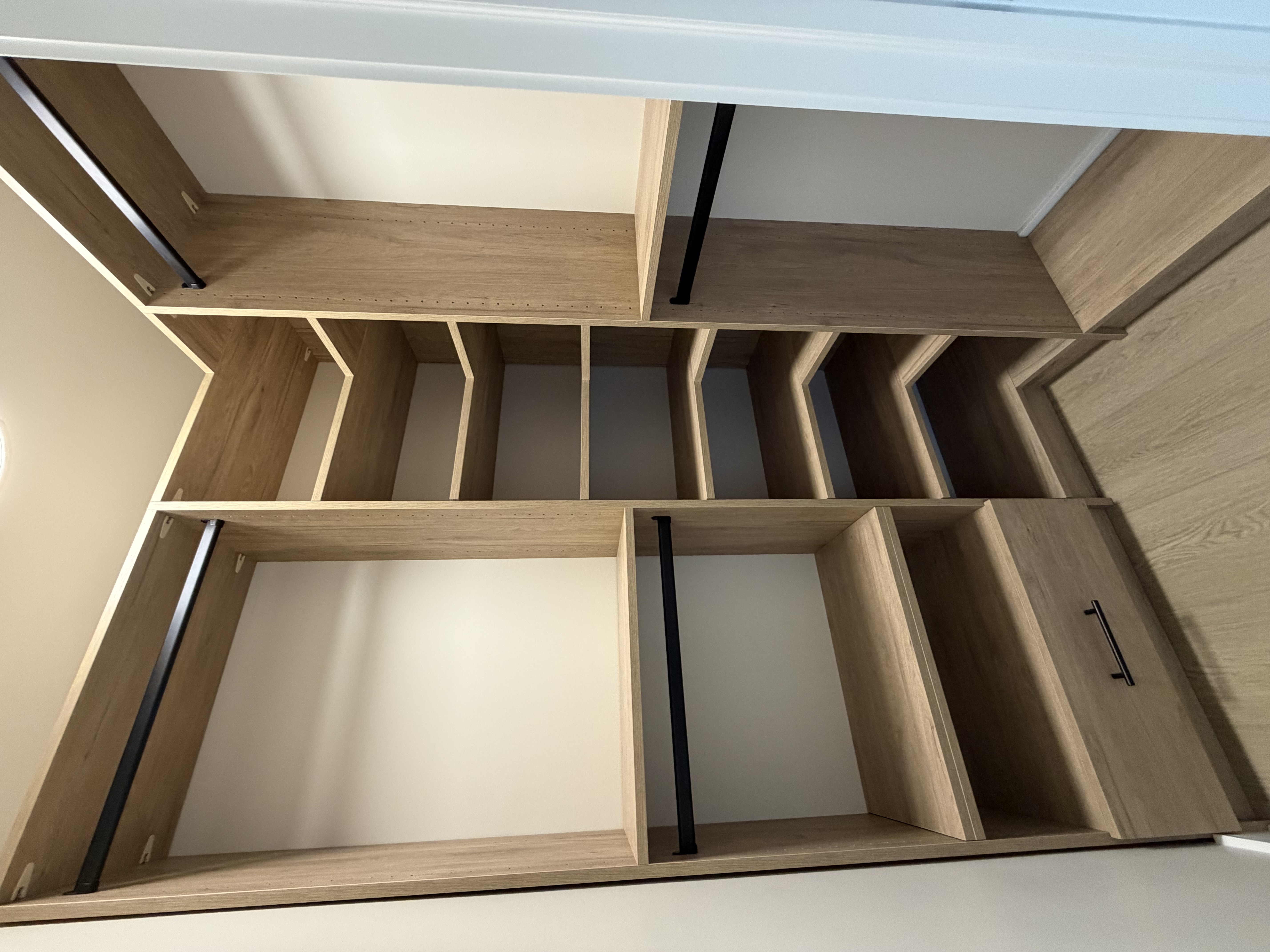 Closet hardware and finish detail on custom storage