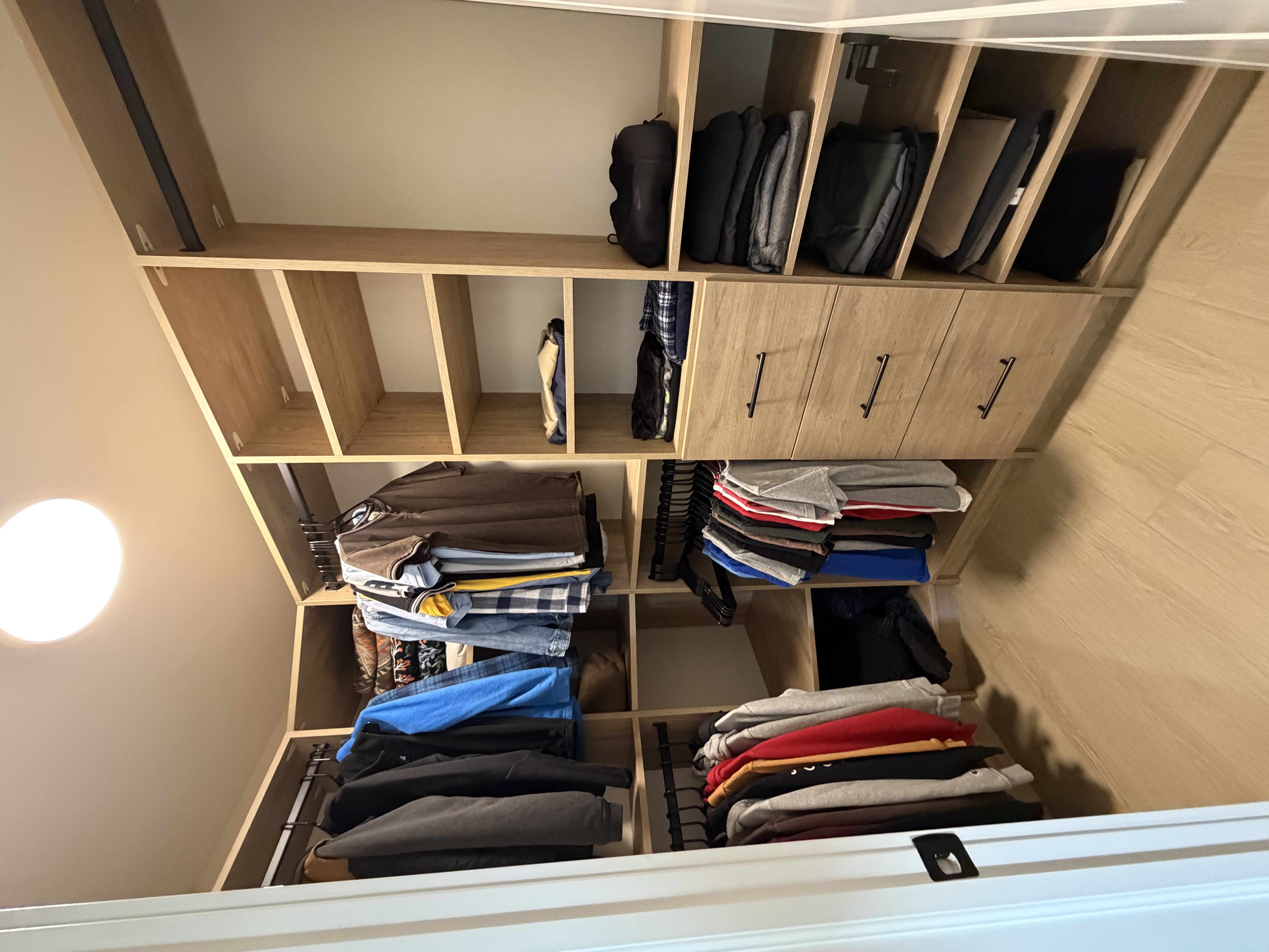 Built-in closet storage with drawers and hanging space